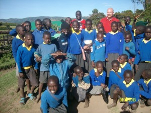 Carl Willis with school children in Kenya